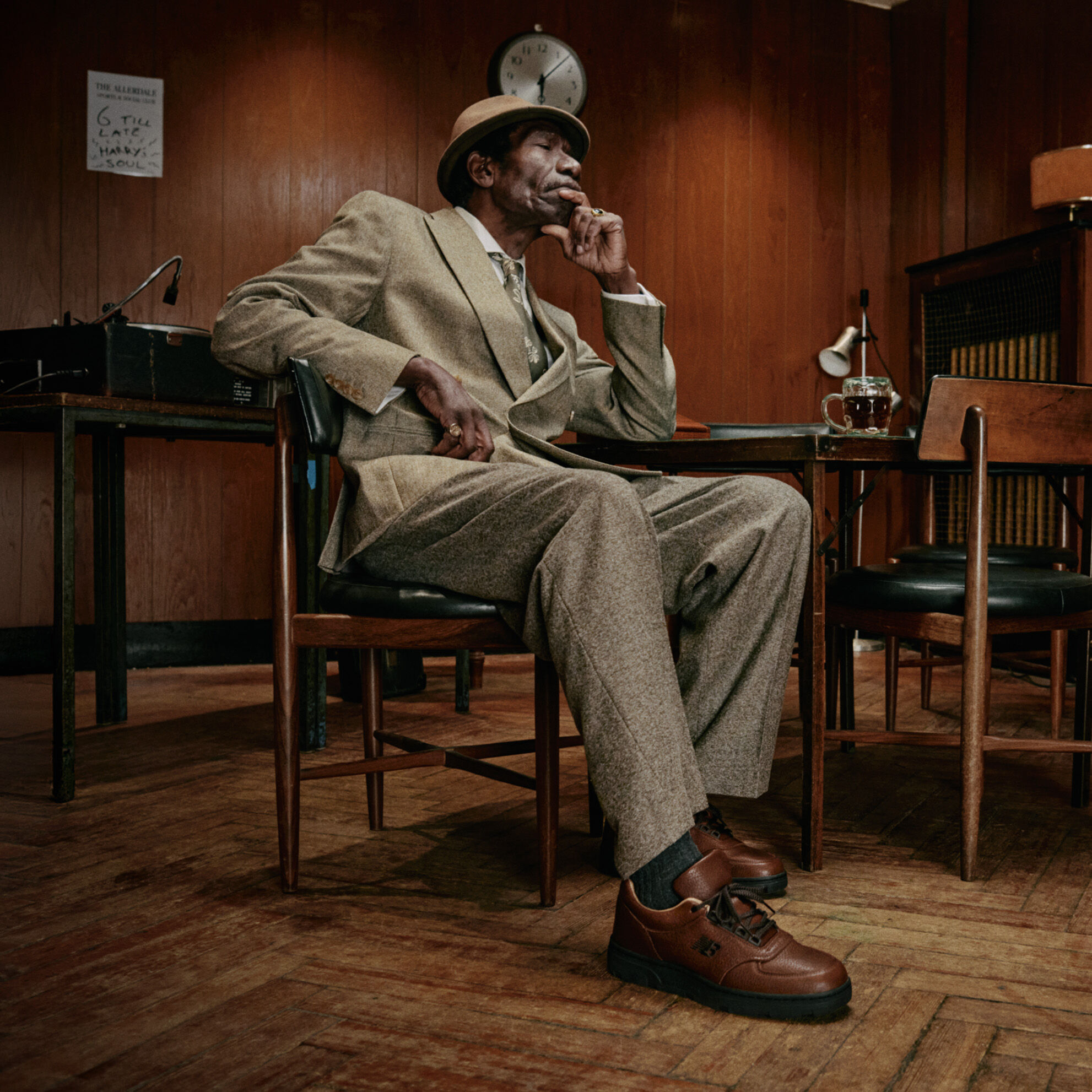 A person sitting on a chair in an office.